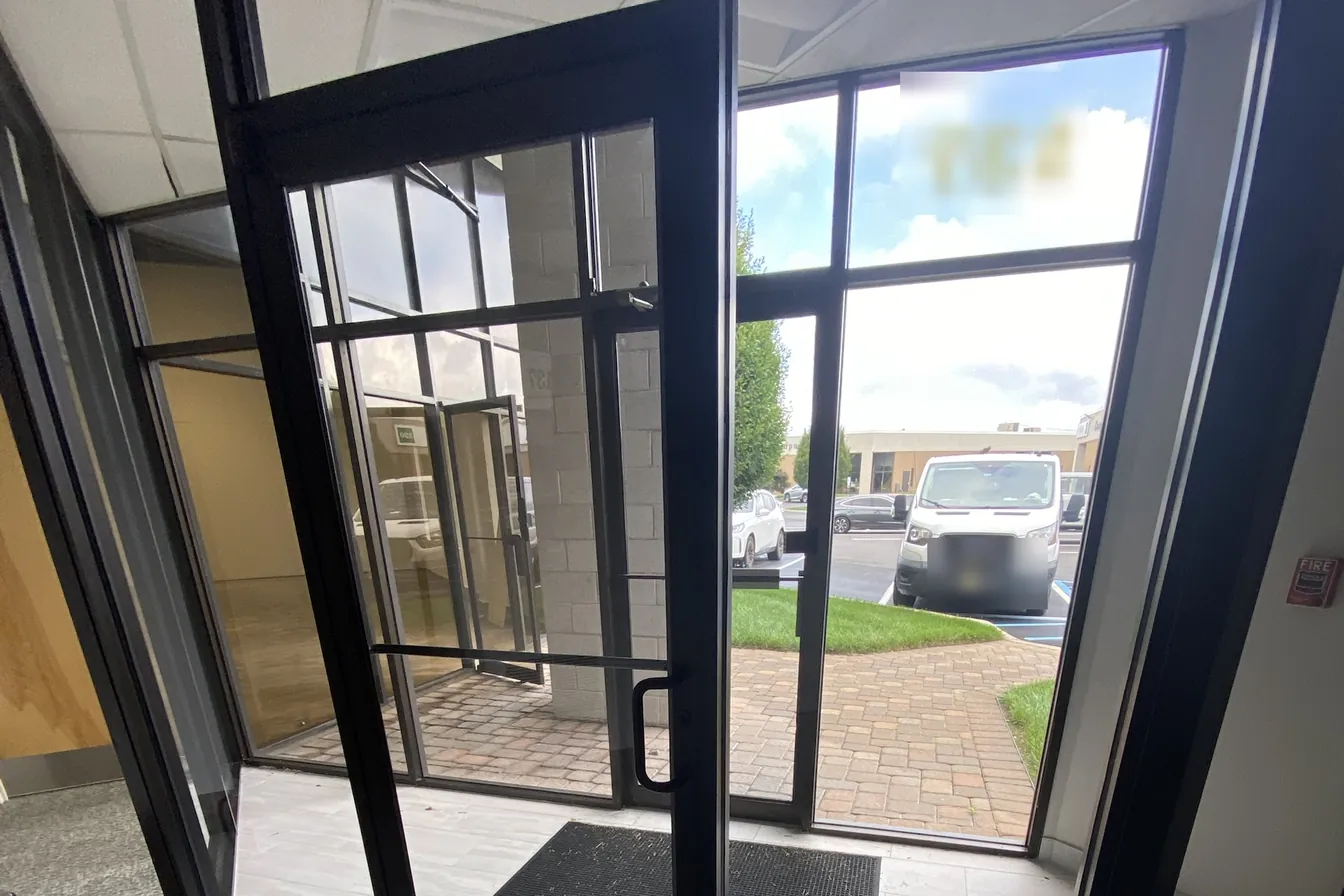 Glass entry vestibule of a newly renovated New Jersey office suite