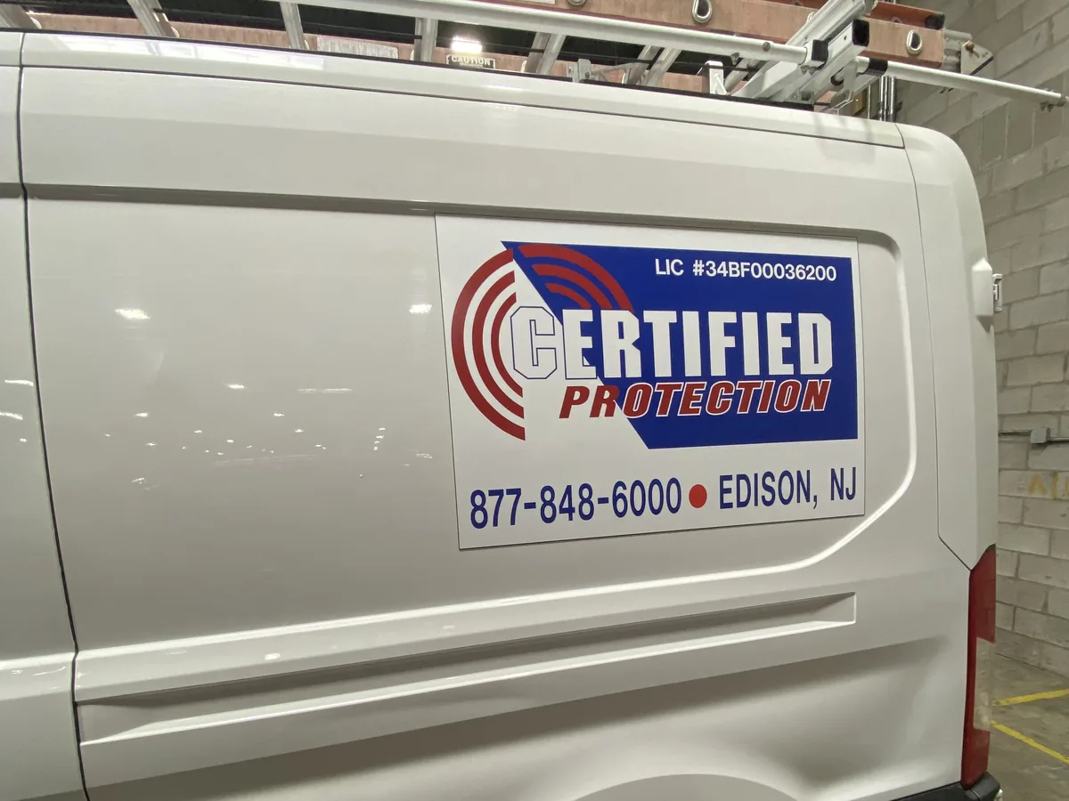 Certified Protection van showing the NJ Electronic Security Contractor license number
